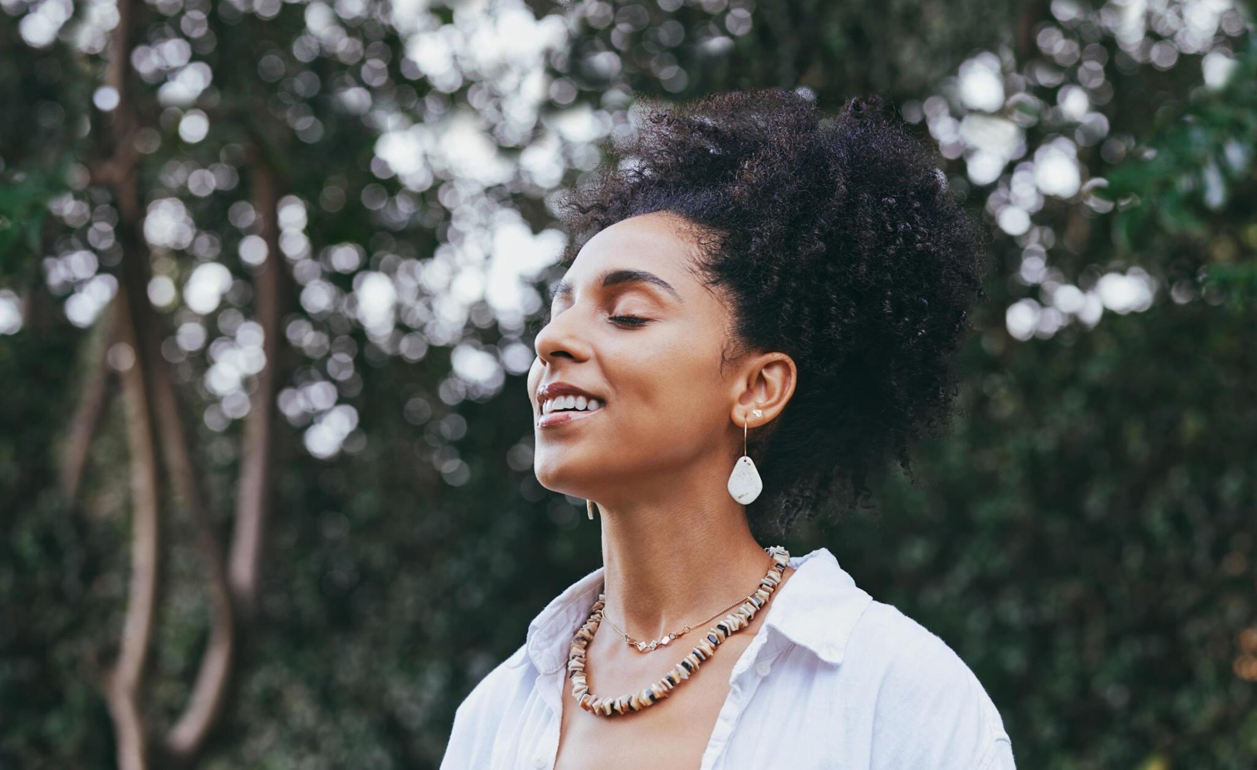 trauma resolution woman feeling relaxed and smiling